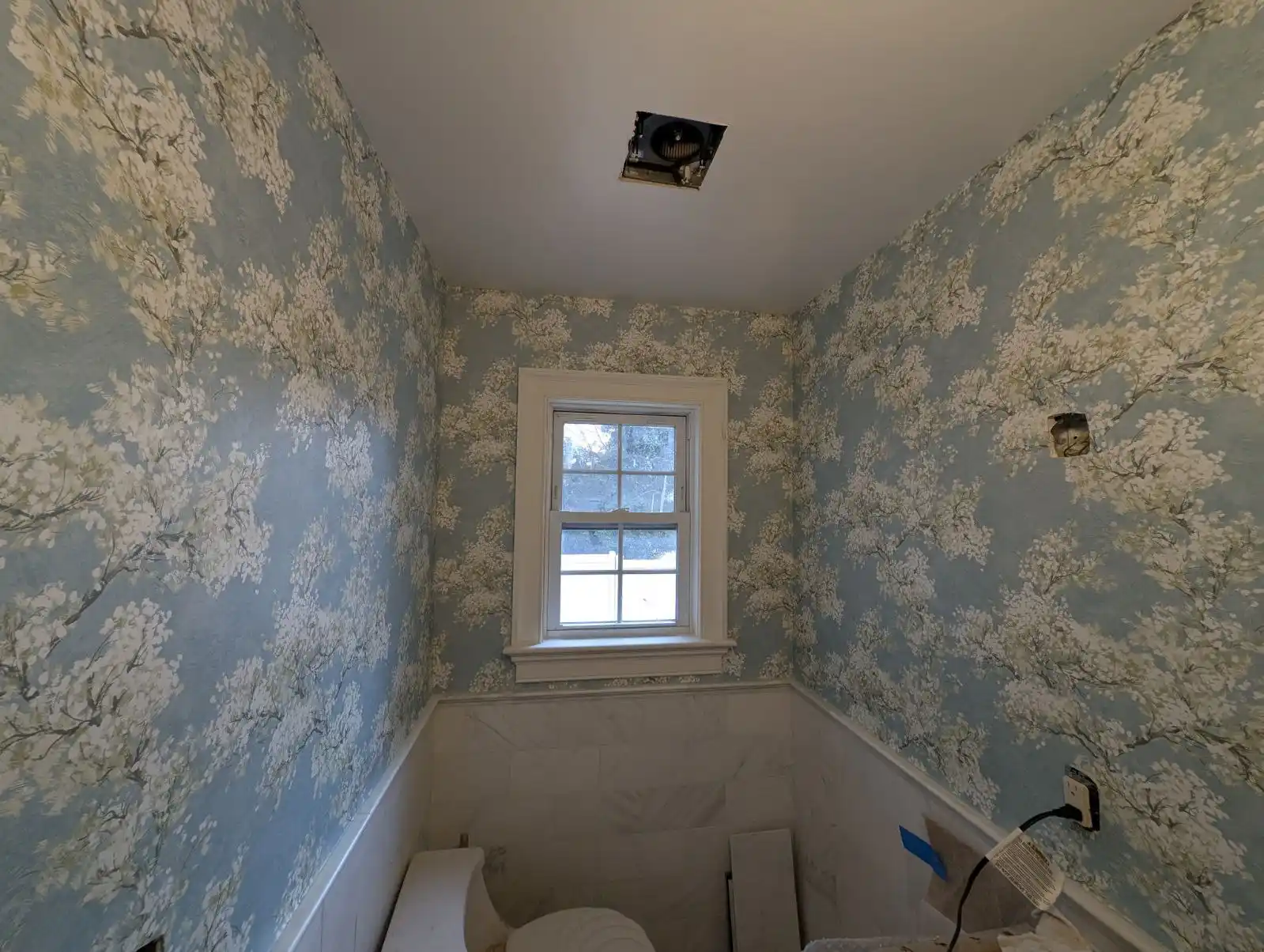 Wallpaper installer at work in Warren neighborhood Michigan