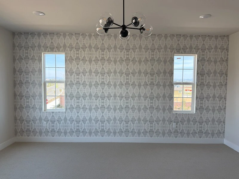 Plaster wall preparation before wallpaper installation in North End, Detroit